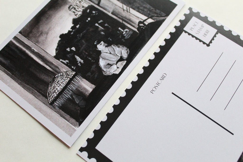 Closeup image of both sides of the "A Night in Paris" postcard. 