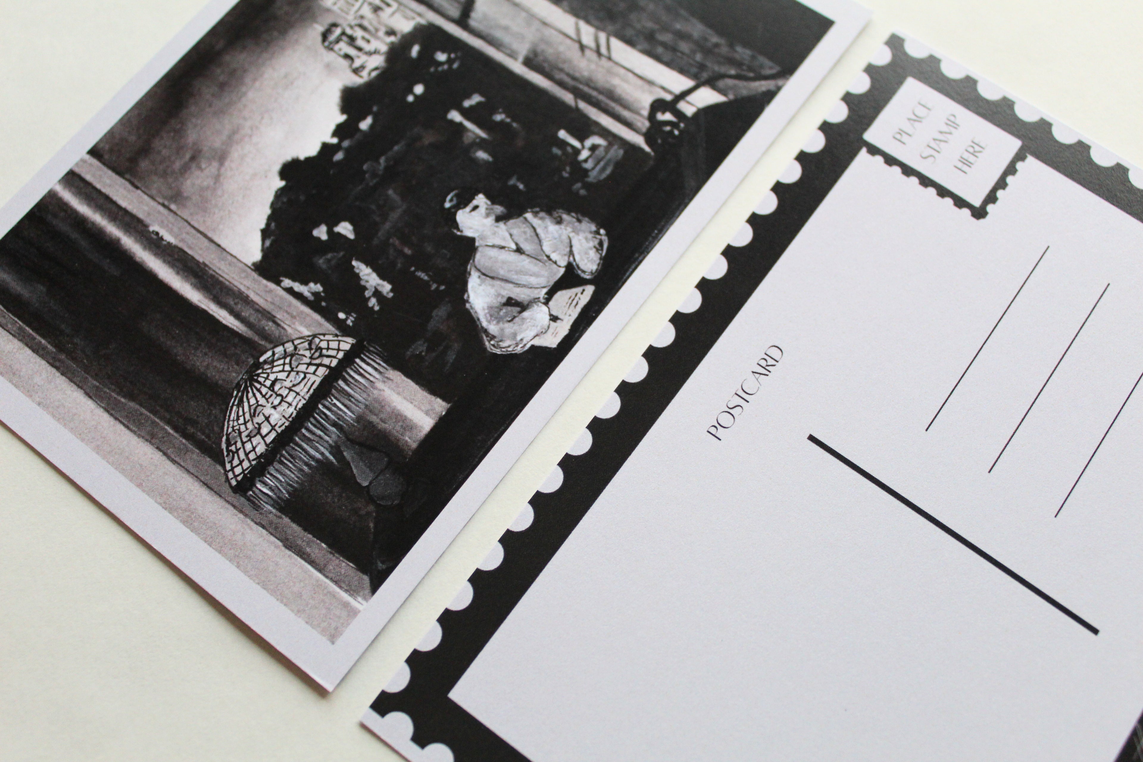 Closeup image of both sides of the "A Night in Paris" postcard. 