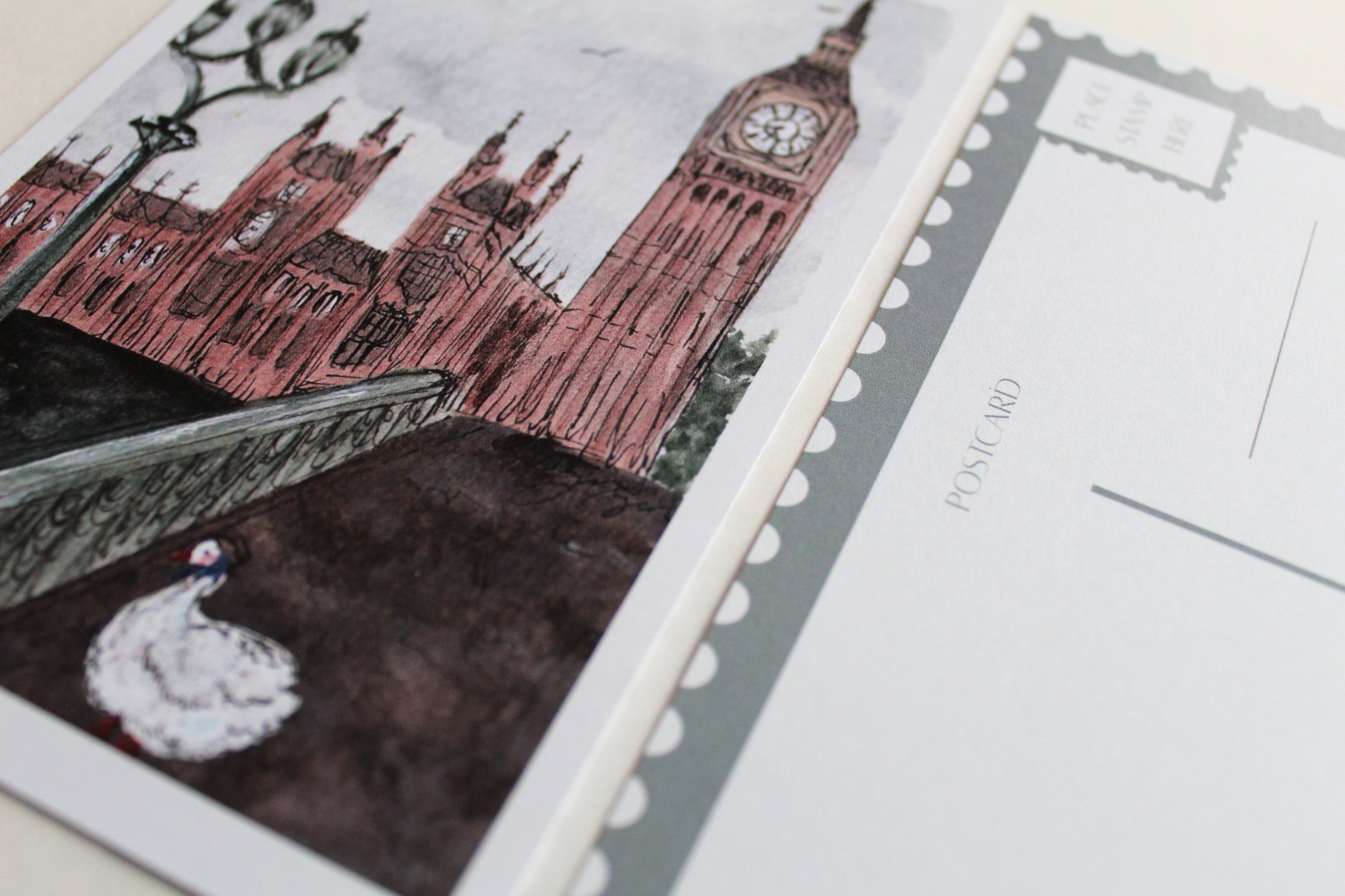 Close up of both sides of the "Duck in London" postcard. 