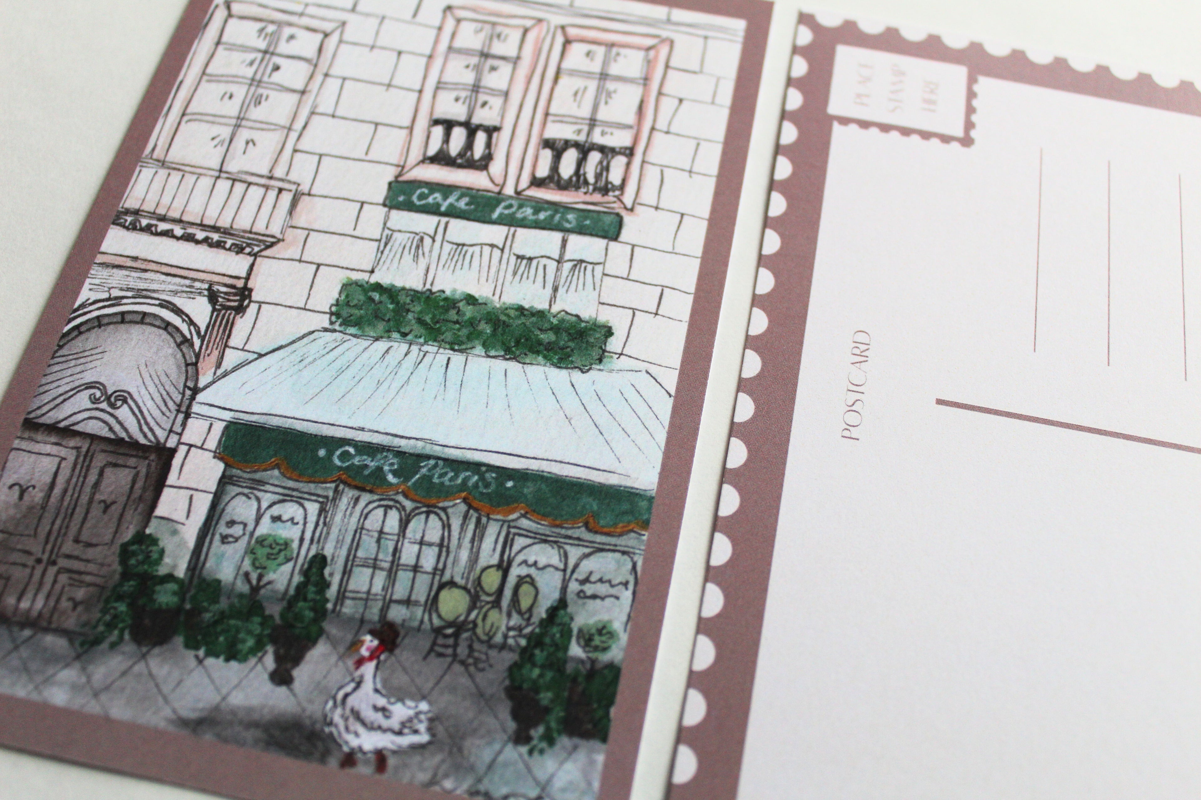 Closeup image of the front and back of the "Duck in Paris" postcard.